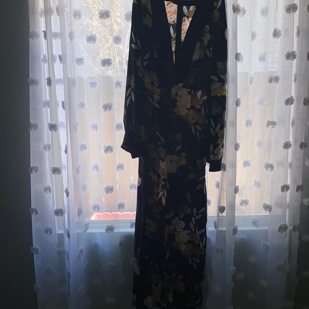 Satin like material dark floral jumpsuit.